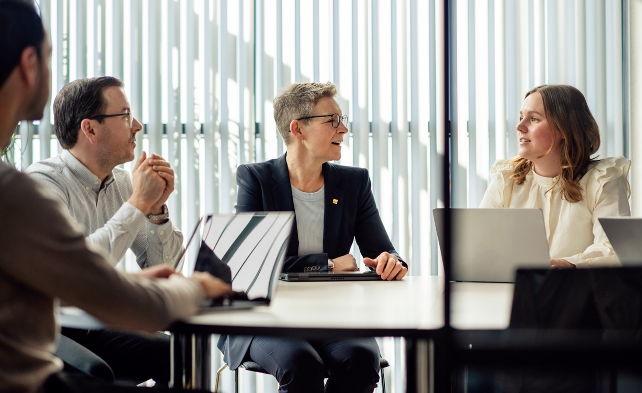 Group of CGI Partners in a meeting room