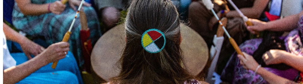 indigenous americans mobile native american woman with back to camera leads drum circle