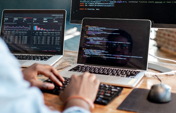 man coding on computer