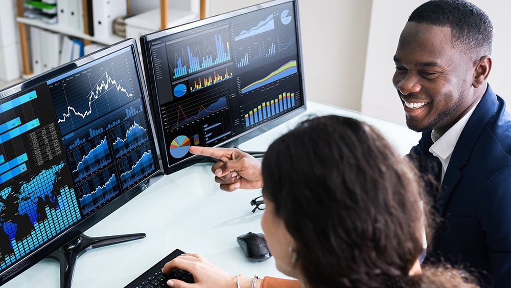 Data strategy advisors working at monitors