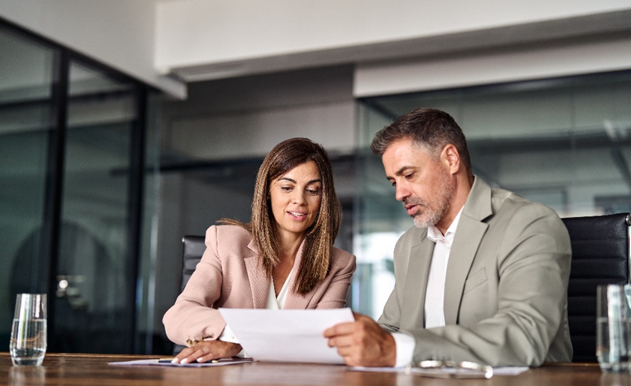 two consultants reviewing documents