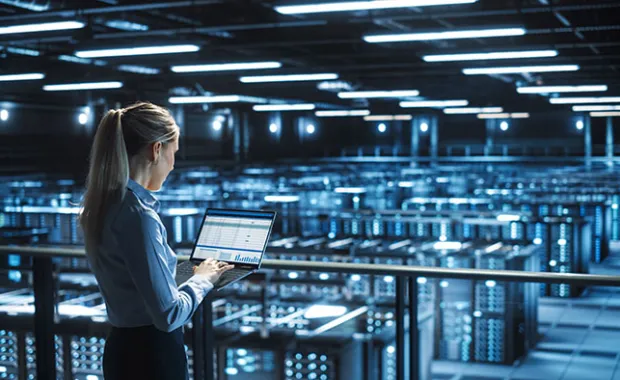 data center specialist holding a tablet