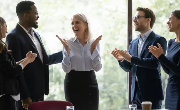 Consultants congratulating each other