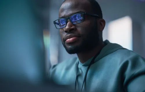 a man looking at a computer screen 