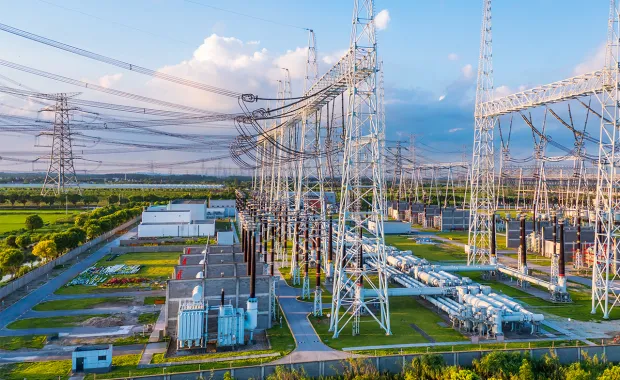 Electrical substation with towers, transformers, and power lines