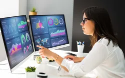 Consultant analyzing data on a desktop computer