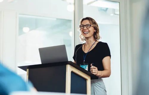 Award recipient speaking at lectern
