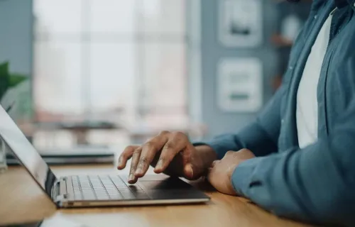 Person typing laptop
