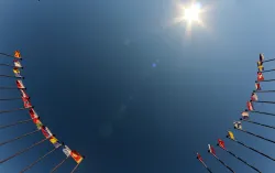 international flags against blue sky