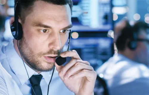 two workers in control room