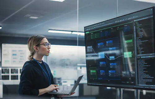 woman working on laptop looking at data